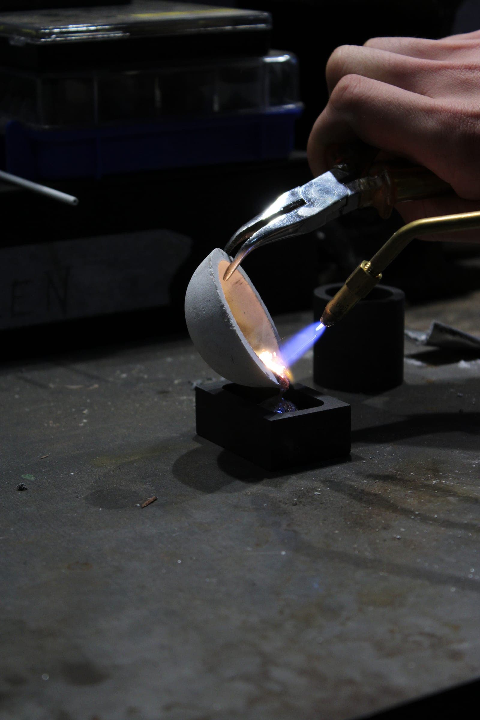 Soldering a piece by hand in the atelier