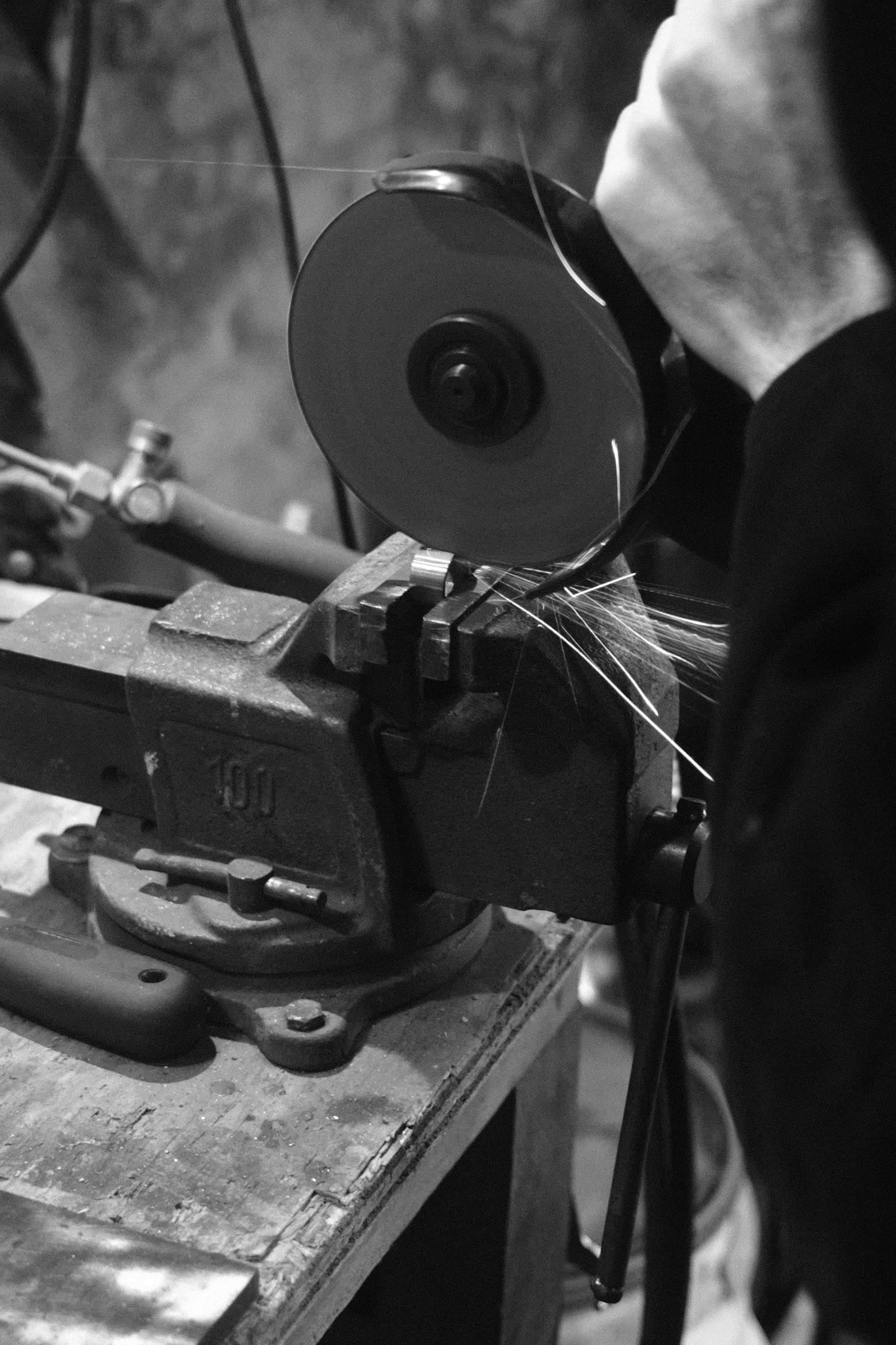 Sparks flying off a grinding wheel in the atelier